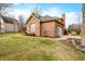 Attached two-car garage featuring a traditional door and exterior lighting at 6002 Turtle Bay Pkwy, Columbus, IN 47201