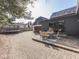 A view of the backyard, which has a basketball hoop, patio, dining area, and trampoline at 6009 N Washington Blvd, Indianapolis, IN 46220