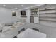 Finished basement featuring modern finishes, a TV area, a wet bar, and a play area with a ' table at 6009 N Washington Blvd, Indianapolis, IN 46220