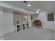 Clean and organized finished basement featuring a map accent wall and designated play areas for  at 6009 N Washington Blvd, Indianapolis, IN 46220
