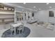 Finished basement featuring recessed lighting, a gray sofa, a play area, and stylish decor for comfortable living at 6009 N Washington Blvd, Indianapolis, IN 46220