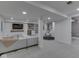 Basement with a living area, a wet bar, and a play area with a table and chairs for flexible living at 6009 N Washington Blvd, Indianapolis, IN 46220