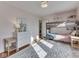Charming bedroom with a bunk bed, hardwood floors, and a soft, patterned rug at 6009 N Washington Blvd, Indianapolis, IN 46220