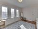 Bright bedroom with hardwood floors, large windows, and a neutral-toned rug at 6009 N Washington Blvd, Indianapolis, IN 46220