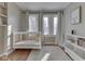 Calming Bedroom features a crib, large windows, hardwood floors, and a soft, white rug at 6009 N Washington Blvd, Indianapolis, IN 46220