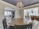 Dining room with chandelier transitions to kitchen, showcases spacious layout, and a neutral decor at 6009 N Washington Blvd, Indianapolis, IN 46220