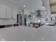 Recently updated kitchen with white cabinets, stainless appliances, and counter seating at 6009 N Washington Blvd, Indianapolis, IN 46220