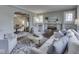 Inviting living room showcasing fireplace, comfortable seating, decorative pillows and seamless transition to dining area at 6009 N Washington Blvd, Indianapolis, IN 46220