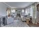 Comfortable living room boasts fireplace, decorative stained glass windows, stylish seating, and elegant decor at 6009 N Washington Blvd, Indianapolis, IN 46220