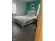 Cozy bedroom with plush white bedding and bright accent wall at 620 W Madison St, Alexandria, IN 46001