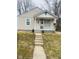 Charming single-story home featuring neutral siding, a covered front porch, and a well-maintained lawn at 620 W Madison St, Alexandria, IN 46001