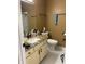Bathroom features a white vanity, granite countertops, modern fixtures, and tile flooring at 6526 Jade Stream Ct # 309, Indianapolis, IN 46237