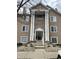 Charming three-story exterior with stone and tan facade, and large columns framing the entryway at 6526 Jade Stream Ct # 309, Indianapolis, IN 46237