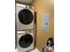 Efficient laundry room with stacked Samsung washer and dryer for space-saving convenience at 6526 Jade Stream Ct # 309, Indianapolis, IN 46237