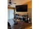 Cozy living area with a large television, decorative fireplace, and modern sound system setup at 6526 Jade Stream Ct # 309, Indianapolis, IN 46237