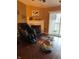 Comfortable living room featuring a fireplace, sliding glass door to balcony and massage chair at 6526 Jade Stream Ct # 309, Indianapolis, IN 46237