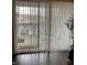 Sliding patio doors with vertical blinds, allowing natural light and providing privacy at 6526 Jade Stream Ct # 309, Indianapolis, IN 46237