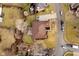 Drone shot of the home showing a patio and large green lawn surrounded by trees at 6528 Hedback Dr, Indianapolis, IN 46220