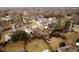 A serene neighborhood is captured from an aerial perspective with tree-lined streets and well-maintained homes at 6528 Hedback Dr, Indianapolis, IN 46220
