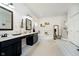 Bathroom featuring a double vanity, soaking tub, and separate shower at 6528 Hedback Dr, Indianapolis, IN 46220