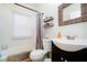 Bright bathroom with a white vanity, toilet, tub, and a framed mirror at 6528 Hedback Dr, Indianapolis, IN 46220
