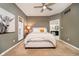 Bedroom featuring a comfortable bed, neutral decor, and an ensuite bathroom at 6528 Hedback Dr, Indianapolis, IN 46220