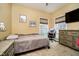 Cozy bedroom featuring warm paint colors, two windows for ample light, and a comfortable bed at 6528 Hedback Dr, Indianapolis, IN 46220