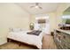 Bright bedroom with a large window and a comfortable bed, dresser, and a mirror at 6528 Hedback Dr, Indianapolis, IN 46220