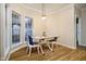Cozy dining area featuring a table, chairs, and natural light from large windows at 6528 Hedback Dr, Indianapolis, IN 46220