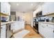 Modern kitchen with white cabinets, stainless appliances, and a spacious layout at 6528 Hedback Dr, Indianapolis, IN 46220