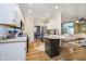 Bright kitchen features white cabinets, stainless appliances, and hardwood floors at 6528 Hedback Dr, Indianapolis, IN 46220