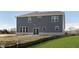 Home's backyard is newly seeded with a sliding door and brick accents on home's exterior at 7181 Barrett Dr, Brownsburg, IN 46112