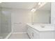 Modern bathroom boasts double vanity, sleek countertops, and a glass-enclosed shower at 7181 Barrett Dr, Brownsburg, IN 46112