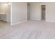 Spacious bedroom features walk-in closet, ensuite bathroom, and neutral carpet at 7181 Barrett Dr, Brownsburg, IN 46112