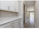 Butler Pantry features modern white cabinets and countertops, offering ample storage and functionality at 7181 Barrett Dr, Brownsburg, IN 46112