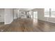 Open-concept kitchen featuring white cabinets, a center island, stainless steel appliances, and lots of natural light at 7181 Barrett Dr, Brownsburg, IN 46112