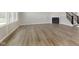 Spacious living room featuring durable floors, a fireplace, and large windows for ample natural light at 7181 Barrett Dr, Brownsburg, IN 46112