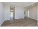 Spacious living room with durable floors, neutral walls, large windows, and ample natural light at 7181 Barrett Dr, Brownsburg, IN 46112