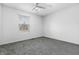 Neutral bedroom with gray carpet, a window with blinds and minimal furnishing at 7463 Pebblebrooke W Dr, Indianapolis, IN 46236