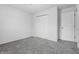 Neutral bedroom with gray carpet, closet and a door to another room at 7463 Pebblebrooke W Dr, Indianapolis, IN 46236
