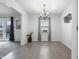 Inviting dining room with large window, neutral decor, and tile flooring at 7463 Pebblebrooke W Dr, Indianapolis, IN 46236