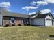 Charming brick home with blue shutters and well-maintained lawn on a sunny day at 7463 Pebblebrooke W Dr, Indianapolis, IN 46236