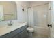 Bathroom with combination tub and shower, toilet, and modern vanity with solid surface countertops at 761 Stone Trace Ct, Avon, IN 46123
