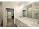 Modern bathroom featuring dual sinks, quartz countertops, and a tiled shower at 761 Stone Trace Ct, Avon, IN 46123