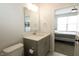 Bathroom features a modern vanity with solid surface countertop, toilet, and a view into an adjacent bedroom at 761 Stone Trace Ct, Avon, IN 46123
