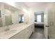 Bright bathroom with dual sinks, and tiled shower visible from bedroom at 761 Stone Trace Ct, Avon, IN 46123