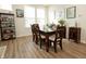 Elegant dining room with a glass-top table, upholstered chairs, and ample natural light from large windows at 761 Stone Trace Ct, Avon, IN 46123