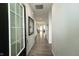 Bright foyer with wood-look flooring, white walls, and view into an open-concept living space at 761 Stone Trace Ct, Avon, IN 46123