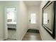 Hallway entrance to bedroom with wood floors and mirror at 761 Stone Trace Ct, Avon, IN 46123