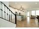 Open concept kitchen with white cabinets, black countertops, and a large center island with bar seating at 761 Stone Trace Ct, Avon, IN 46123